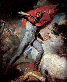 A man in skin-tight clothing looks to the sky; his left hand holds down a white horse, and in his right a sword poised to pierce the horse's neck. Several armoured figures in the background look at the man and his horse.