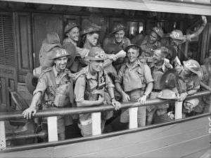Men wearing military uniforms on board a ferry