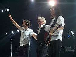 l-r:Paul Rodgers, Roger Taylor, and Brian May live in 2005 for the Queen + Paul Rodgers tour.