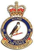 Military crest for 81 Wing, Royal Australian Air Force, with crown atop and hawk in centre; the motto reads "Prepared to fight"