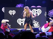 Ariana Grande performing.
