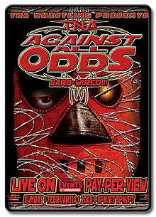 A poster featuring a man in a red mask, with the mask covered in barbed wire with a red logo saying "Against All Odds" and "BARBED-WIRED!!!" directly below at the top of the poster.