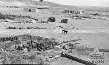 Water basin under construction, with horse tethered in center