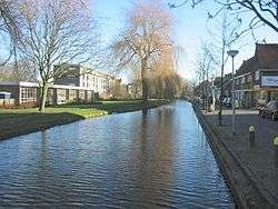 Straight canal with buildings on both sides