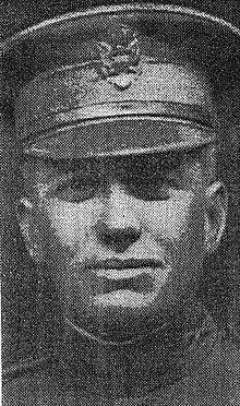 Head of man in his late twenties, wearing a U.S. Army officer's peaked cap
