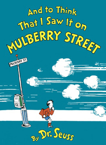 Book cover. Against a blue background, yellow lettering at the top reads, "And to Think That I Saw It on Mulberry Street". At the bottom in yellow, "by Dr. Seuss". In the middle, a boy stands on a street, looking to the viewer's right, watching a cloud of smoke and zip lines leading off the page. To his left is a pole with a sign reading "Mulberry Street" on it.