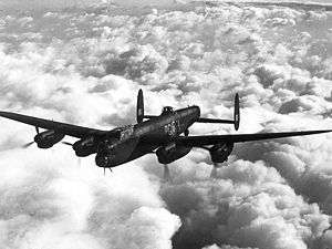 An inflight image of a four-engined bomber aircraft