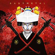 A figure with a kitsune (fox) mask wearing a headpiece and a black robe on a red background, holding two shamisen criss-cross behind it. The word "BABYMETAL" appears at the top of the artwork in a yellow font.
