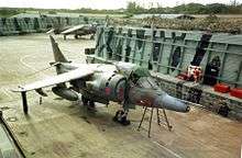 A Harrier stored at an airfield