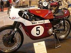 Red-and-white racing motorcycle in museum