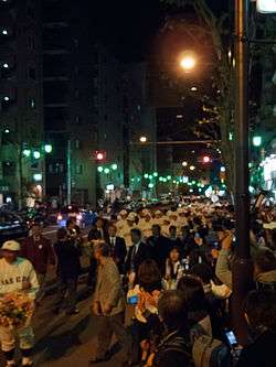Waseda Victory parade in 2010 showing the players and a crowd of by-standers