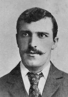 A man wearing a jacket and tie.