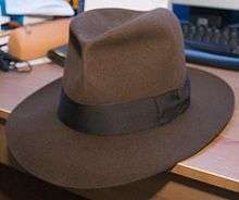 A brown, leather, fedora-style hat