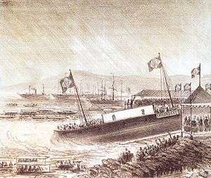 Lithograph depicting a harbor scene with crowds in grandstands, along the shore and in boats watching the launching of a ship