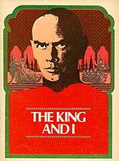 Theatrical program cover reading "The King and I" dominated by the image of a middle-aged man with shaved head and a brooding expression. Small images representing scenes from the musical are seen behind him.