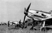 four Messerschmidt Me 109 E of Fighter Wing 51 "Mölders" on a grass airfield