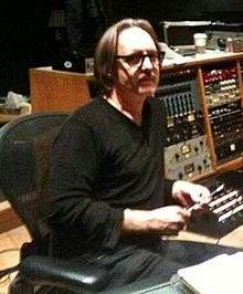 Vig sitting at a mixing console