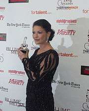Catherine Zeta-Jones posing with an award