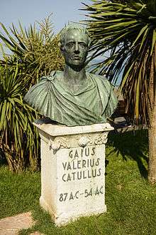 Photograph of a bronze bust of a man.  It rests on a stone plinth, on which the words "Gaius Valerius Catullus 87 AC–54 AC" are written.