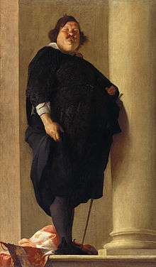 A very obese gentleman with a prominent double chin and mustache dressed in black with a sword at his left side.