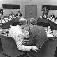 Pierre Trudeau and Jean Chrétien conferring, photographed from behind