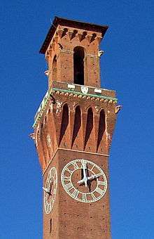 The upper section of the station's clock tower, with the features described in the text