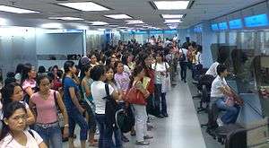 Government office, with long lines of young people
