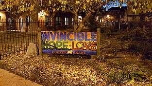A community sign near Camden's Cooper Grant neighborhood showcasing the cities unofficial tagline "A City Invincible"