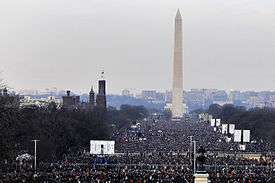 View of the entire length of the National Mall and the Washington Monument with a large audience of attendees