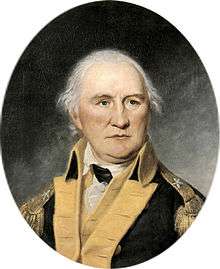 A head-and-shoulders portrait.  Morgan is in a brigadier's uniform (one star on the shoulder epaulet), blue jacket with gold facing.  He is balding with white hair, and stares without expression over the viewer's right shoulder.