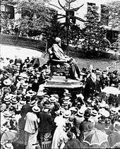 Unveiling of the bronze Darwin Statue outside the former Shrewsbury School building in 1897 surrounded by schoolboys in straw hats