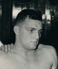 A headshot of Sensanbaugher in a locker room from 1944