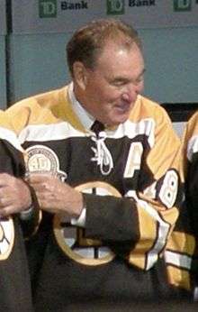 Ed Westfall wearing a Boston Bruins jersey and the assistant captain's "A" on it.