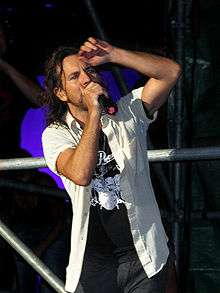 Eddie Vedder sings in a stage.
