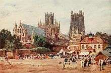 Watercolour The Market Place, Ely by W. W. Collins published 1908 showing north-east aspect of Ely Cathedral in the background with the Almonry in front of that and the now demolished corn exchange building to the right of the picture