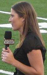 female reporter holding microphone