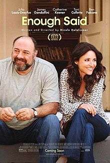 The film poster features a photo of a bearded, balding white man in a grey t-shirt and a brunette woman in a dotted dress shirt. Both are sitting on a stoop and smiling, with the primary cast and title "Enough Said" above them. Under the title, "Written and directed by Nicole Holofcener" is visible. At the bottom, the poster's billing block can be seen.