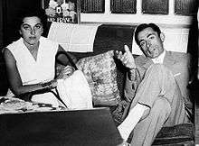 Fausto Coppi and Giulia Occhini sitting on a sofa