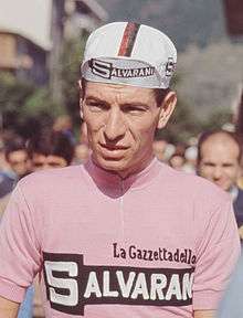 Cyclists wearing a pink jersey.