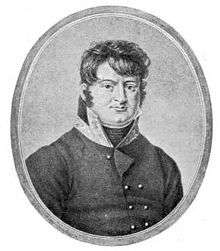 Black and white print shows a determined-looking man with a cleft chin. He wears a gray military coat with a high collar.