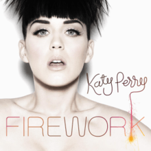 A woman with a firework hair like a boy and a white background and the brown letter is 'Katy Perry' and the orange letter is 'FIREWORK'