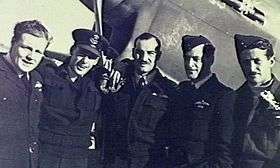 Informal portrait of five men in dark military uniforms