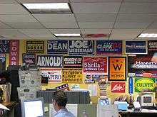 Newsroom, with political signs on the wall
