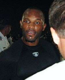 Torso shot of Fred Taylor, a 30-ish African-American man, in black t-shirt.
