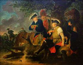 Four men are gathered under a tree. One, Frederick the Great, has his shirt sleeve rolled up and a second man is wrapping a bandage around his arm. A grenadier watches what he does. Another man, in a tri-cornered hat, stands at Fredrick's side. In the background, soldiers load and fire cannons.