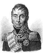 Black and white print shows a slightly-smiling man wearing a gaudy dark military uniform of the early 1800s, with epaulettes, a high collar and much embroidery.