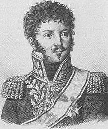 Black and white print of a man with a moustache and small goatee in a dark military uniform with epaulettes and a high collar