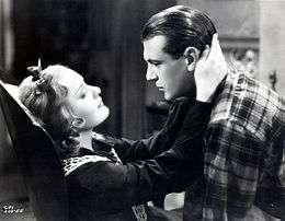Photo of Gary Cooper and Anna Sten embracing each other