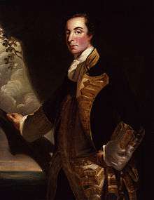 A three-quarter-length portrait of Admiral Rodney in relative youth.  He stands before a mostly dark background; his right hand rests on what looks like a large tree branch, behind which the sea is visible.  He wears a dark coat with gold embroidery over a white waistcoat.