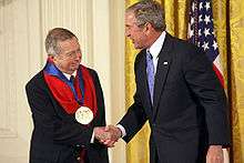 George Tooker receiving the National Medal of Arts from George W. Bush